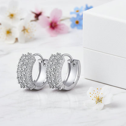 Mosaic Italian Design Micro Inlaid Moissanite Earrings set in Platinum Plated 925 Silver (GRA) Capella Reya close up next to box