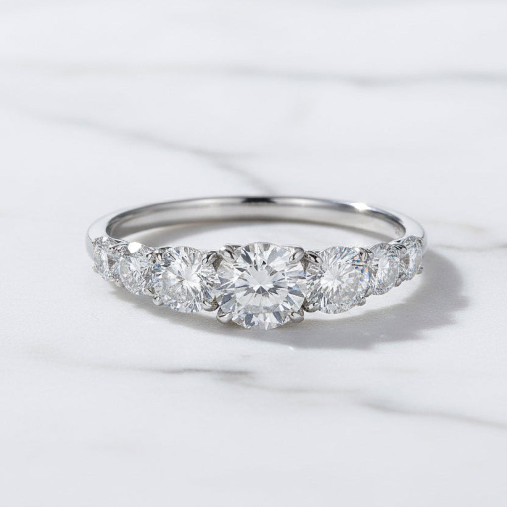 European Seven Stone 0.5 Carat Moissanite Diamond Ring set in Platinum Plated 925 Silver (GRA)