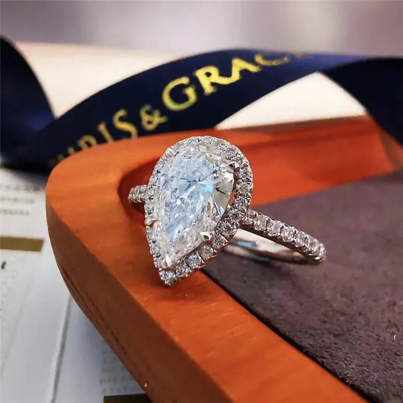 French Teardrop Pavé-set 2 Carat Moissanite Diamond Ring set in 18K White Gold Plated 925 Silver