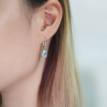 Lady Blue French Natural Topaz Gemstone Pendant Earrings set in 18K White Gold Plated 925 Silver Capella Jewellery woman wearing image