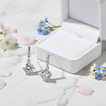 European Snowdrop Inspired 2 Carat Moissanite Earrings set in 18K White Gold 925 Silver (GRA) Capella Jewellery next to box