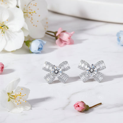 French Bow Design 1 Carat Moissanite Earrings set in Platinum Plated 925 Sterling Silver Capella Reya close up image