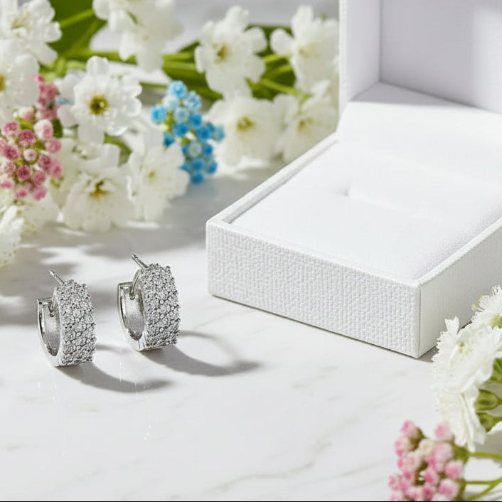Mosaic Italian Design Micro Inlaid Moissanite Earrings set in Platinum Plated 925 Silver (GRA) Capella Reya next to box