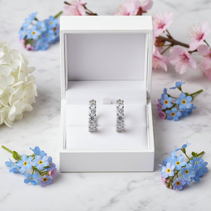 European Diamond Row 1 Carat Moissanite Earrings set in Platinum Plated 925 Silver (GRA) Capella Reya front in a box image